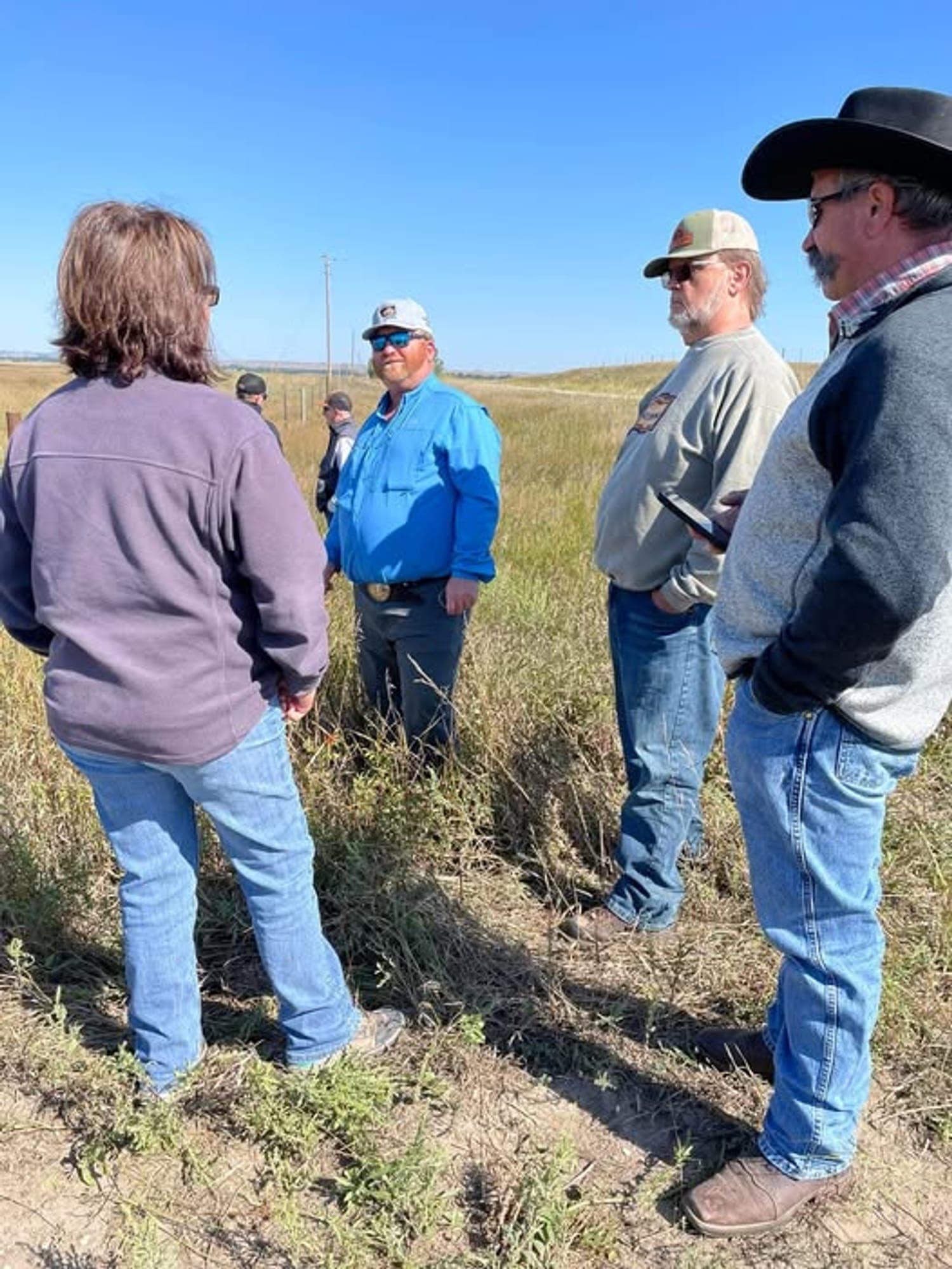 Mary Scott, NRCS, with her back to the camera, visits in the field with Moritz Espy; Rod Sather, owner of Mosquito Park Buffalo; and Chad Kremer, owner at Kremer Buffalo and herd manager at Custer State Park.
Lot of awesome people in this picture.